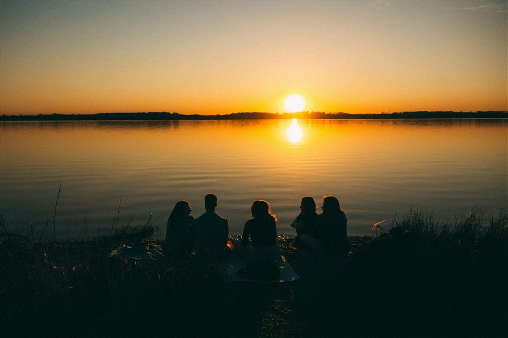 A small team gathered together during a relaxed offsite session.